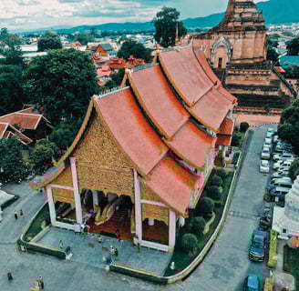 a large building with a red roof and a large building