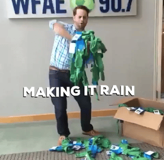 a man in a green shirt and a green shirt with a green hat on it