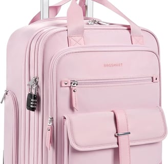 a pink suitcase with a suitcase on wheels