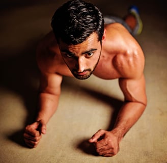 a man doing push ups on a floor