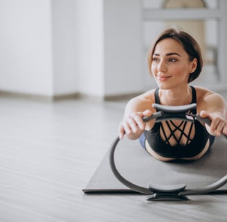 a woman is doing a wheel with a hoople