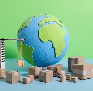Globe representing global trade with packages stacked next to it, symbolizing international shipping