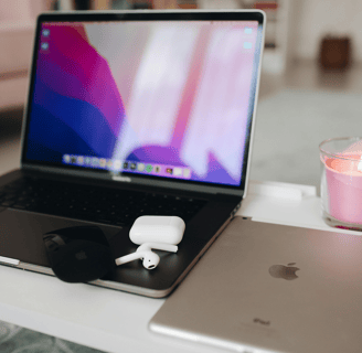a set of apple airpods 4 on a laptop computer sitting on a table