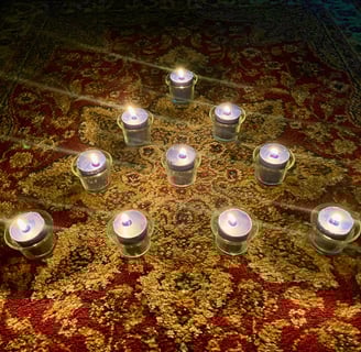 Ten candles on a rug.