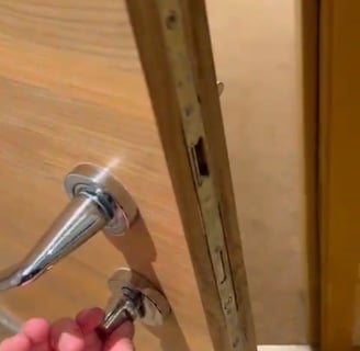 hamdyman fixing the door
