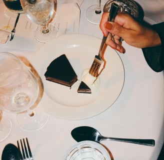 a woman eating desert at a restaurant booked through piano piano concierge where she met her husband