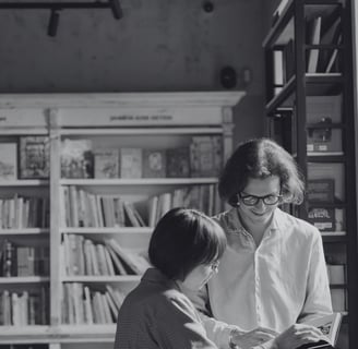 a man and woman standing in a bookshop after connecting on piano piano