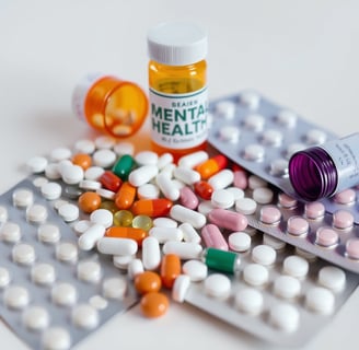 "Various types of mental health medications on a table, representing different treatment options."