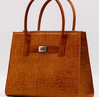 a brown leather handbag with a brown alligator skin by Heros Leather HN
