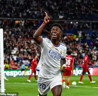 Vinícius scoring or celebrating a Champions League final goal.