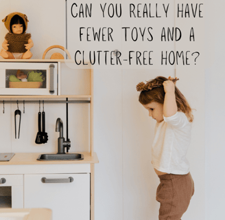 a little girl standing in front of a white refrigerator