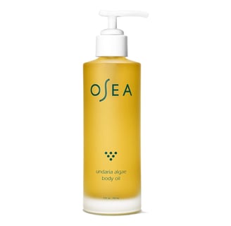 a bottle of oceane body lotion with a pump of liquid