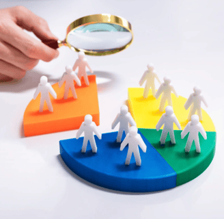 Magnifying glass analyzing audience on pie chart | Market research and customer segmentation