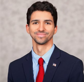 a man in a suit and tie with a red tie