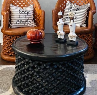 display of bamileke handmade side stool and king chairs