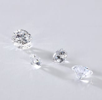 a group of three lab grown diamonds