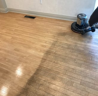 "Photo of a job in progress of a dirty vinyl floor in a small office in Daytona Beach, FL."