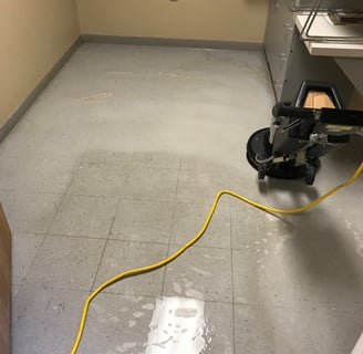 "Tile Stripping in a medical office in Ormond Beach, FL by TEC Floor Services."