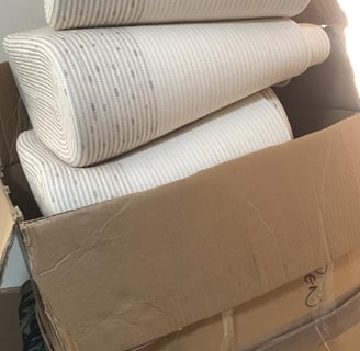 a stack of boxes with a lot of bags
