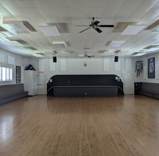 Large interior room & stage at American Legion Post 172 meeting hall. It is available to rent.