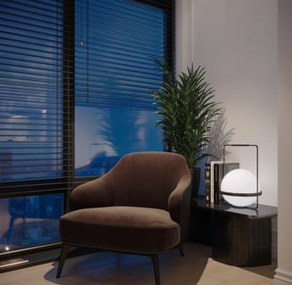 a chair with a side table and a lamp on it