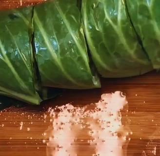 dark cabbage leaves sliced on cutting board