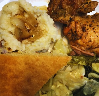 baked chicken and mashed potatoes and cabbage dinner