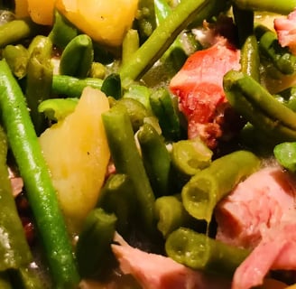 Close-up of southern style green beans with smoked meat and tender potatoes