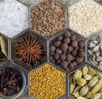 a tray of whole spices and some powdered.