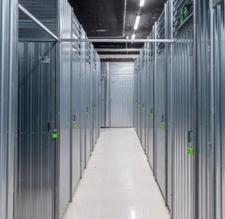 a long hallway with metal steel doors and a long hallway