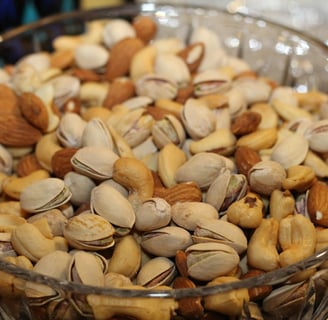 a bowl of nuts and nuts in a glass bowl