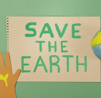 a paper cutout of a hand holding a globe
