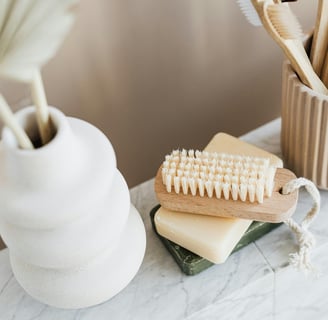 a wooden toothbrush and a toothbrush on a table