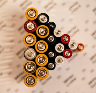 a pile of batteries on a table