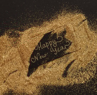 a happy new year's day message with gold dust scattered on top of it