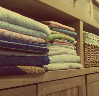 a bunch of towels and towels on a shelf