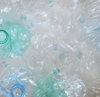 a bunch of plastic bottles with plastic lids ready for recycling
