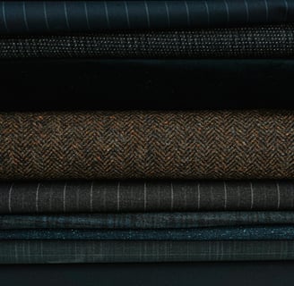 a stack of different colored fabrics and fabrics