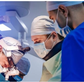 a group of surgeons performing surgery in a hospital