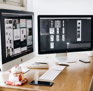 a desk with a computer monitor and a keyboard