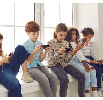 Adolescents all looking at devices