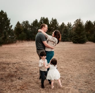Duluth Family Photo in a field on a cloudy day