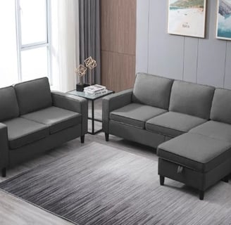 Dark gray sectional sofa in a cozy living room, featured by Regal Touch Home