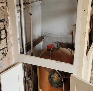 Old gravity-fed heating system before conversion in Skegness
