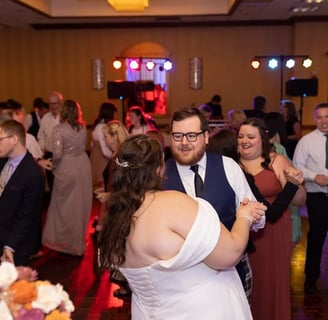 a bride and groom dancing at their wedding reception