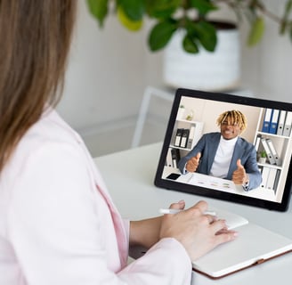 Young man having a video conversation with a woman