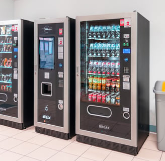 a row of vending machines in a room