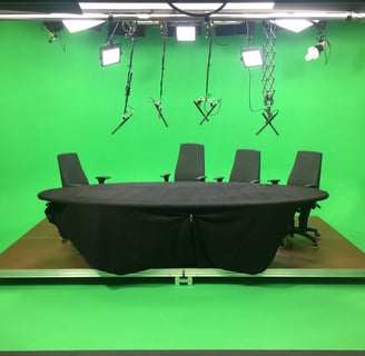 conference table, green screen, panel discussion