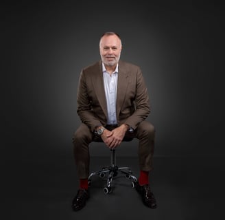 a man in a suit and red socks