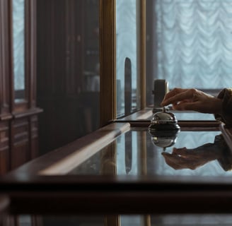 a person sitting at a table with a cup of coffee